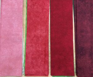 red fabrics for holiday friends quilt