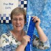 woman with blue fabric strips