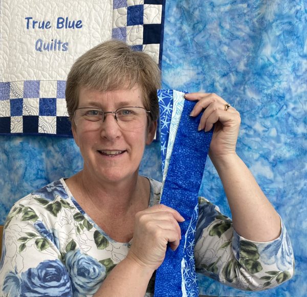 woman with blue fabric strips