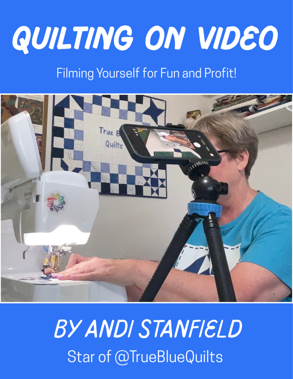 Cover of Quilting on Video book cover shows a woman at a sewing machine behind a camera on a tripod. Title is Quilting on Video, Filming Your Craft for Fun and Profit by Andi Stanfield, star of @TrueBlueQuilts